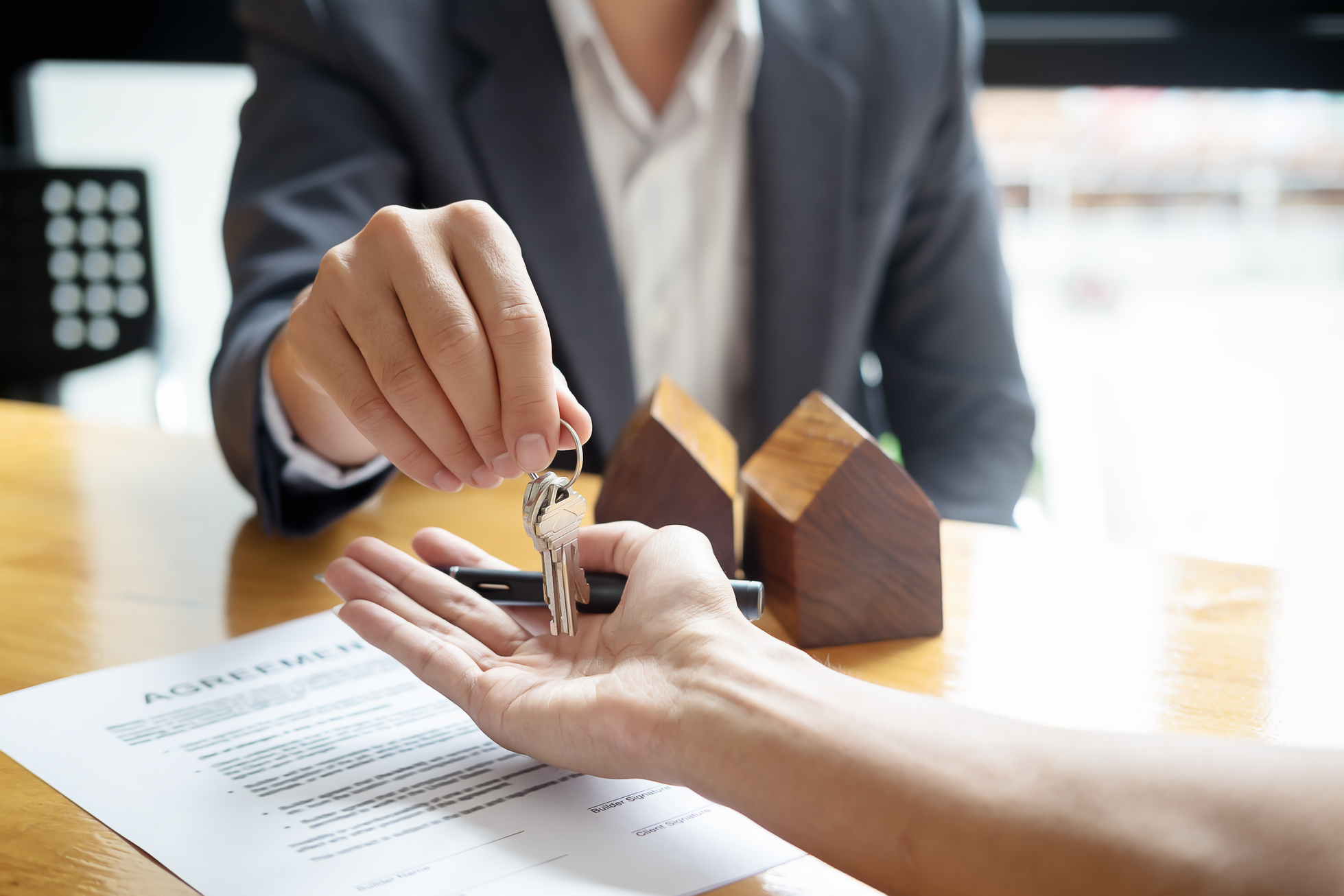 Real Estate Agent Giving Key to Client